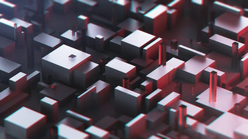 Kleine Würfel stellen abstrakt eine Stadt dar.