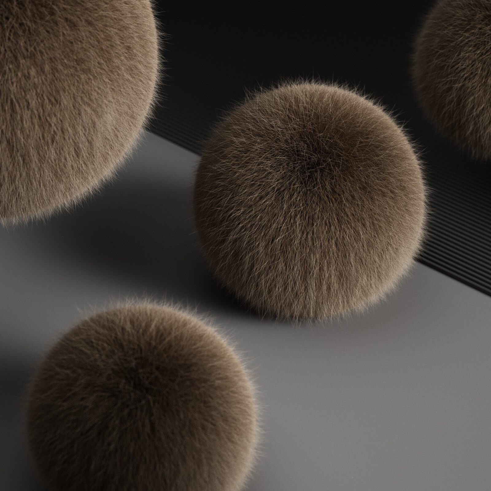 3 Kugeln, mit Fell bedeckt.