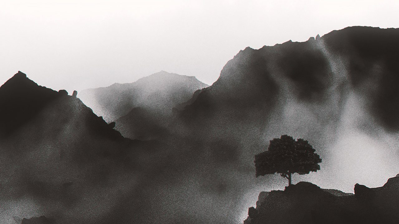 Eine Pinie vor einem Bergpanorama.