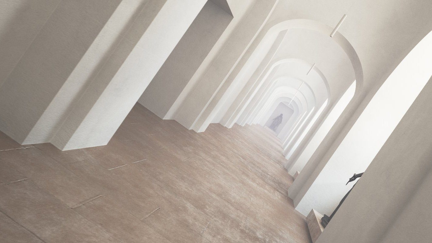 Ein langer Gang mit Rundbögen und Steinboden. Am Ende des Ganges ist eine dunkle Statue.