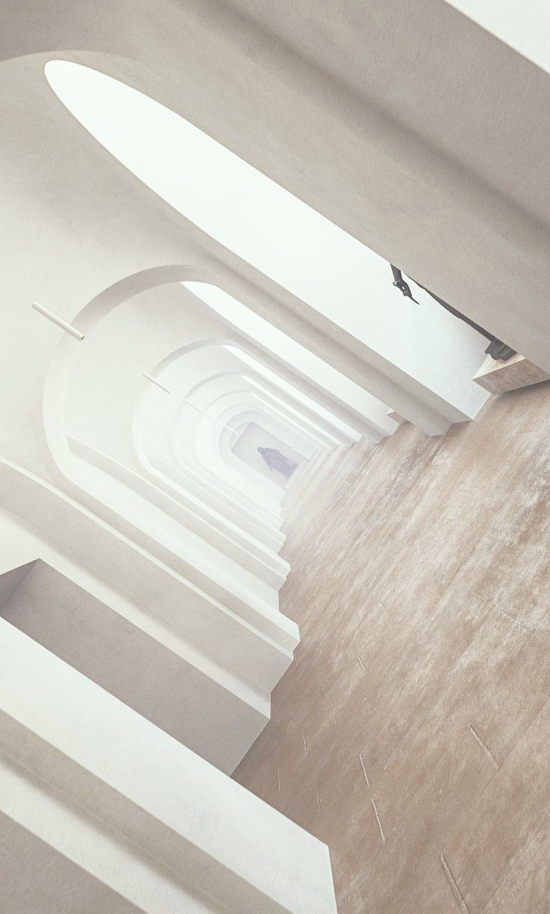 Langer historischer Flur. Am Ende des Ganges sieht man eine schwarze Statue stehen.